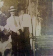 Fred Schoel & J. P. Turner standing by a swing at the old River Road Park.